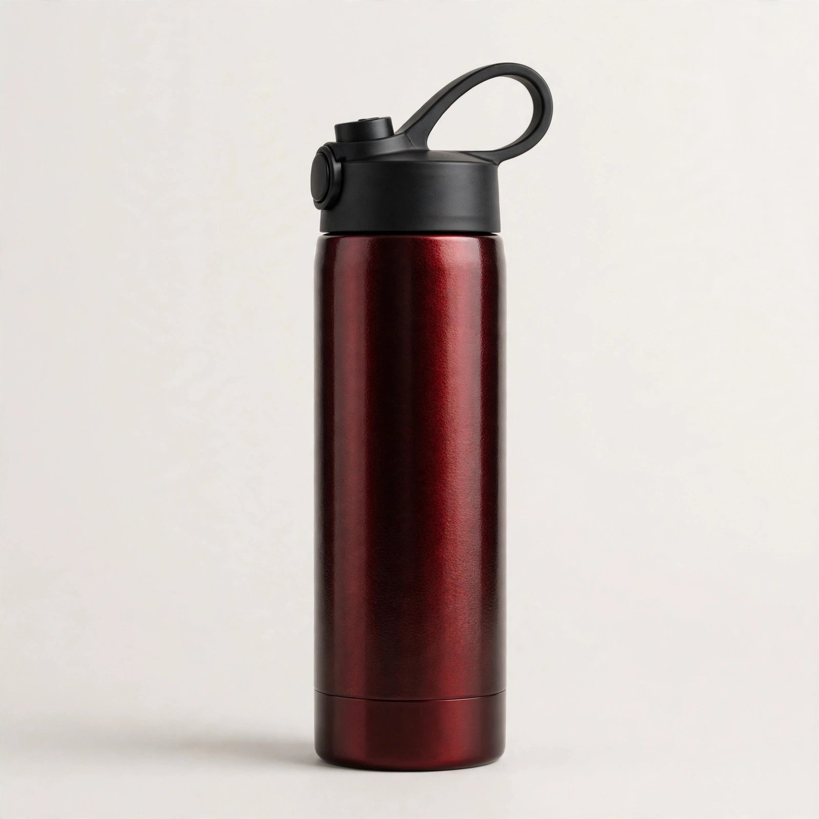 Owala FreeSip 24 oz insulated stainless steel water bottle in Black Cherry, studio product shot